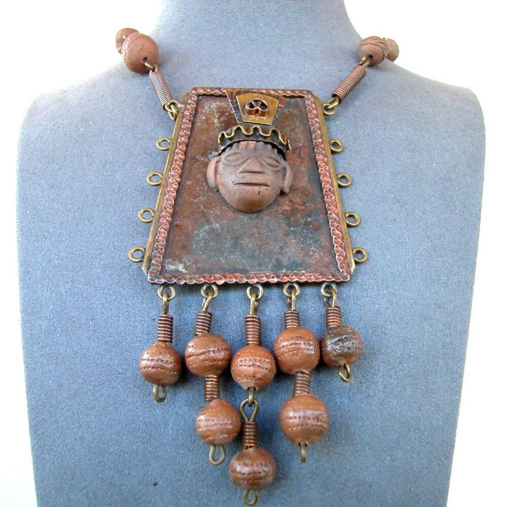 This is a vintage copper and clay Mayan/Aztec pendant bead necklace,